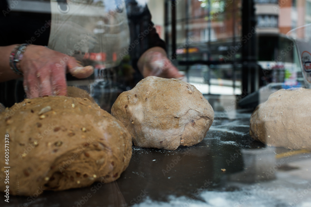 Unrecognizable woman preparing bread with seeds Unrecognizable woman preparing bread with seeds