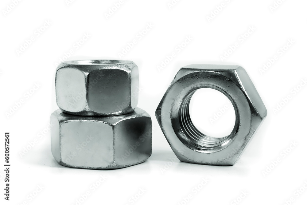 Metallic nuts. Picture taken in studio with soft-box and white background representing some mechanical components. Metallic nuts. Picture taken in studio with soft-box and white background representing some mechanical components.