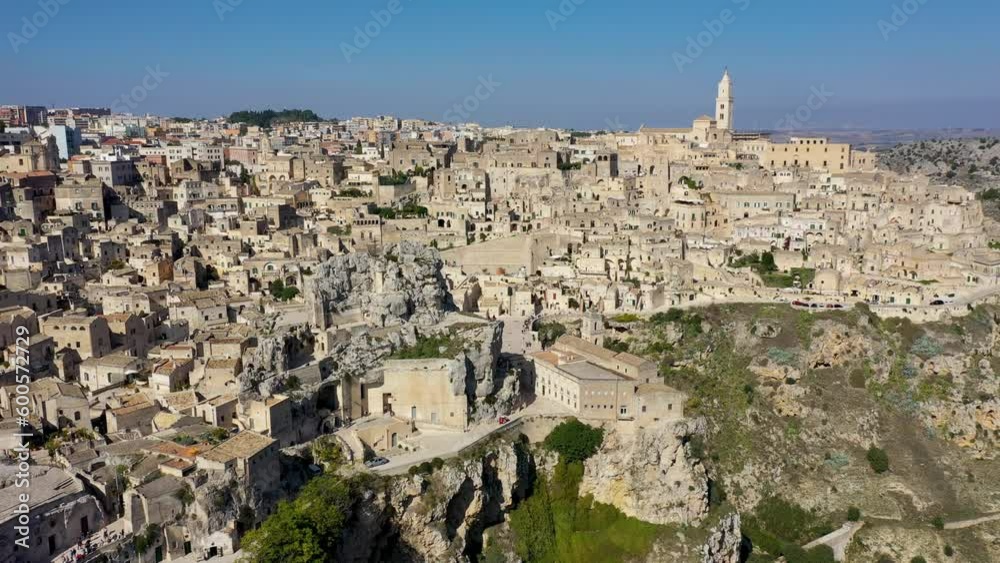 Panoramic view of the ancient town of Matera (Sassi di Matera) in a beautiful autumn day, Basilicata, southern Italy. Stunning view of the village of Matera. Matera is a city on a rocky outcrop. Panoramic view of the ancient town of Matera (Sassi di Matera) in a beautiful autumn day, Basilicata, southern Italy. Stunning view of the village of Matera. Matera is a city on a rocky outcrop.