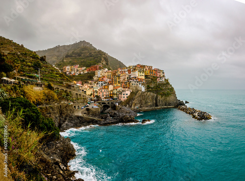 Travel to Italy: colorful houses Manarola village on the cliff © 9parusnikov