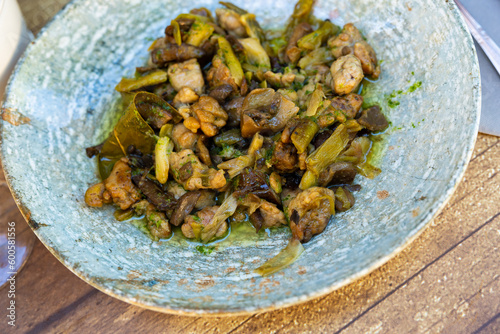 Lechecillas de ternasco, Aragonese dish made of lamb's glands, served on plate in restaurant. photo