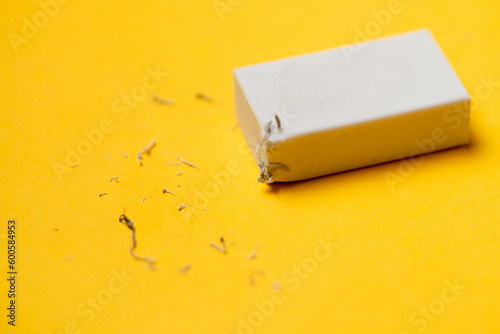 Cuadro en lienzo White eraser on a yellow background. Rubbish from erasure.