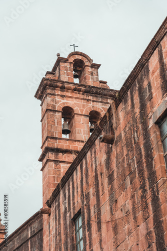 view of the cathedrals of the center of the city of Cusco, main square, green parks