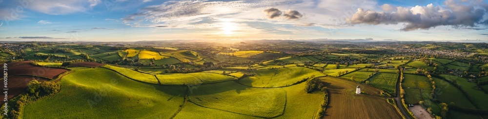 Sunset over Fields and Farmlands in spring from a drone, Devon, England,  Europe