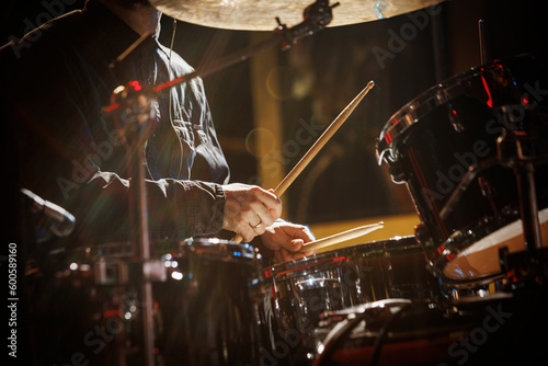 Canvas Print The drummer plays with drumsticks on the rock drum set