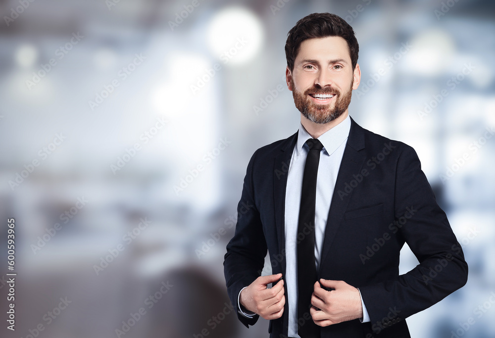 Handsome real estate agent in office, space for text Handsome real estate agent in office, space for text