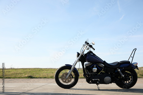 Fototapeta Naklejka Na Ścianę i Meble -  Modern black motorcycle on sunny day outdoors
