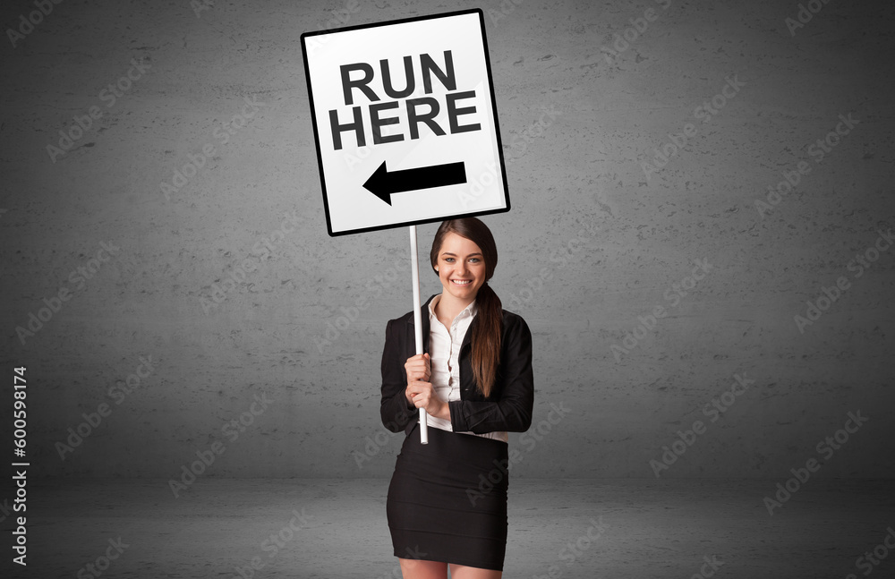 business person holding a traffic sign business person holding a traffic sign