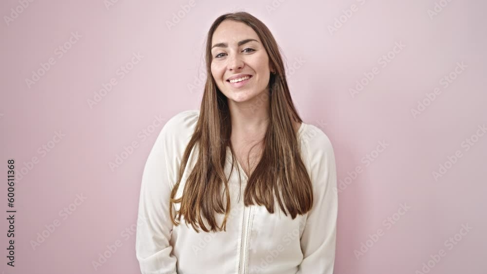 Young beautiful hispanic woman smiling confident standing over isolated pink background Young beautiful hispanic woman smiling confident standing over isolated pink background