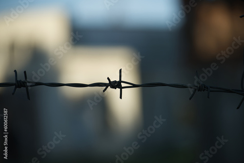 Silhouette of coils of old rusty barbed wire