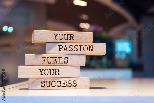 Wooden blocks with words 'Your passion fuels your success'. Inspirational motivational quote.
