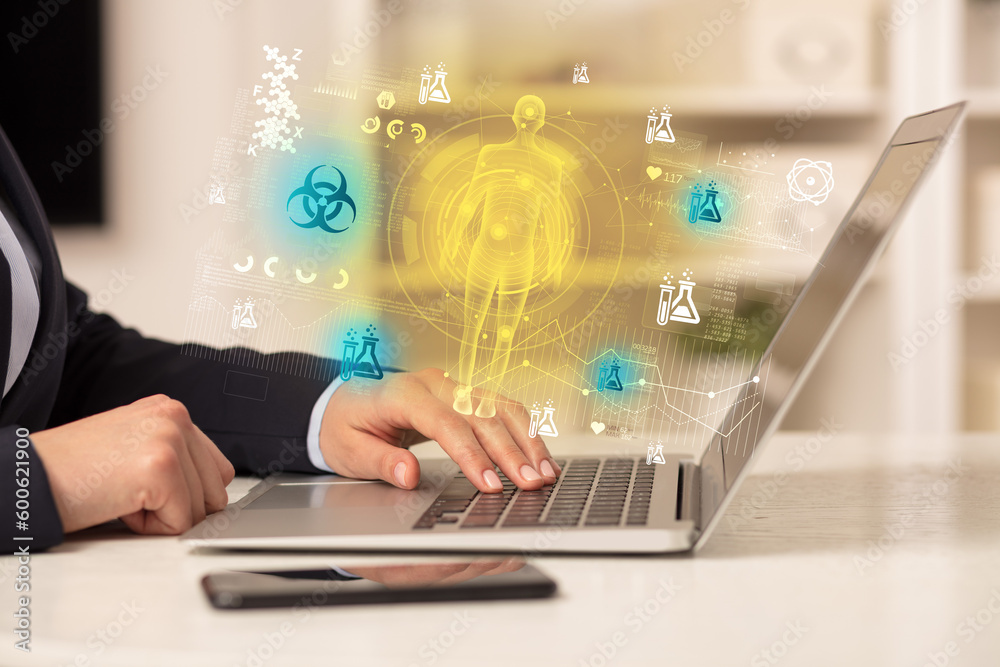 Doctor working on laptop with healthcare concept