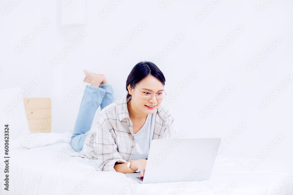 Asian women chatting with friends at her bedroom happily Asian women chatting with friends at her bedroom happily