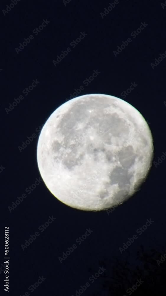Time lapse: moon ghostly appears through dark eerie clouds at pitch black night Time lapse: moon ghostly appears through dark eerie clouds at pitch black night