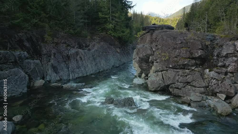 Fresh Water running down the river and rocks. Taken in Vancouver Island, British Columbia, Canada. Nature Background. Cinematic Fresh Water running down the river and rocks. Taken in Vancouver Island, British Columbia, Canada. Nature Background. Cinematic