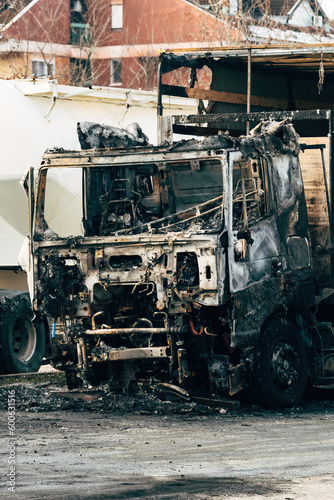 Semi truck engulfed by fire flames after traffic accident is burned and damaged
