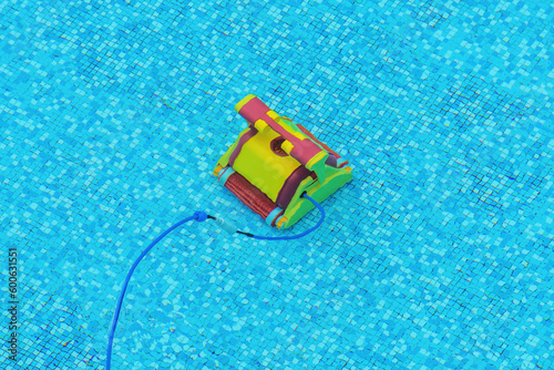 Robotic swimming pool cleaner in operation at the bottom of the pool © Bits and Splits