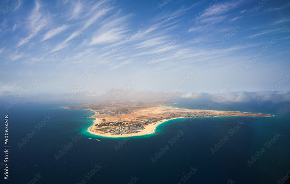 Cabo Verde. Aerial view of Sal Island from the middle of Atlantic Ocean, an amazing beach resort, during a sunny day with blue sky and turquoise blue water color. - obrazy, fototapety, plakaty 