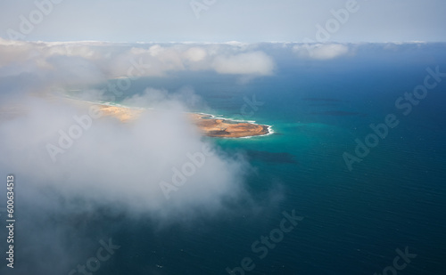 Fototapeta Naklejka Na Ścianę i Meble -  Cabo Verde. Aerial view of Sal Island from the middle of Atlantic Ocean, an amazing beach resort, during a sunny day with blue sky and turquoise blue water color.