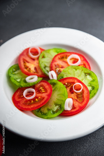fresh vegetables salad red tomato and green tomato dish healthy meal food snack on the table copy space food background rustic top view keto or paleo diet veggie vegan or vegetarian food