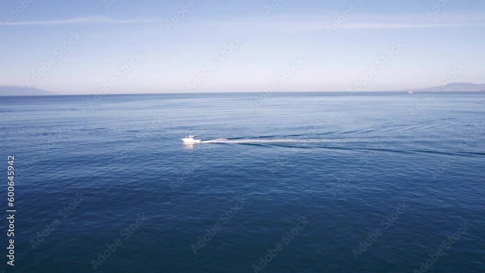 Drone video captures the vast sea along the coasts of Puerto Vallarta, featuring a luxury yacht cruising through the deep blue waters, showcasing the beauty of the ocean and the vessel. Drone video captures the vast sea along the coasts of Puerto Vallarta, featuring a luxury yacht cruising through the deep blue waters, showcasing the beauty of the ocean and the vessel.