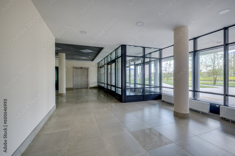 empty modern hall room with columns, doors and panoramic windows. empty modern hall room with columns, doors and panoramic windows.