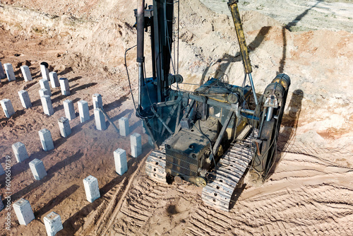 Pile driving machine. Diesel hammer pile driving machine working on construction site. Preparation of the pile foundation for the construction of the building.