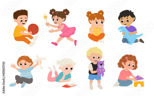 Children, kids play together having fun, fooling around in fine good mood, on playroom, playground. Preschool kids have fun. Children's activity in the kinder garden, primary school.