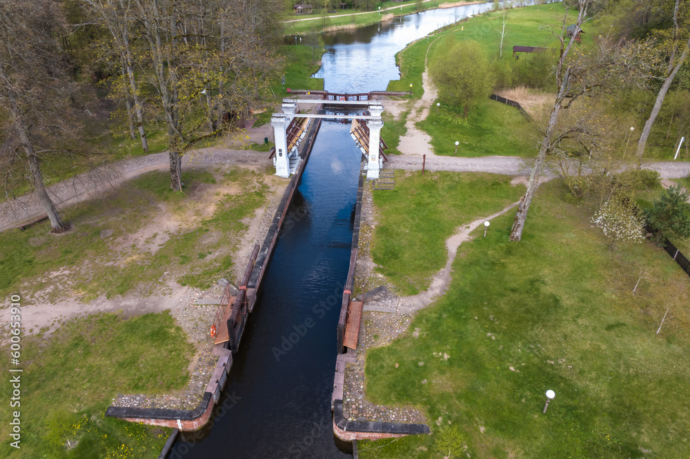 aerial view over dam lock sluice on lake impetuous waterfall aerial view over dam lock sluice on lake impetuous waterfall
