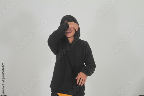 expressive Indonesian man smiling on white background isolated
