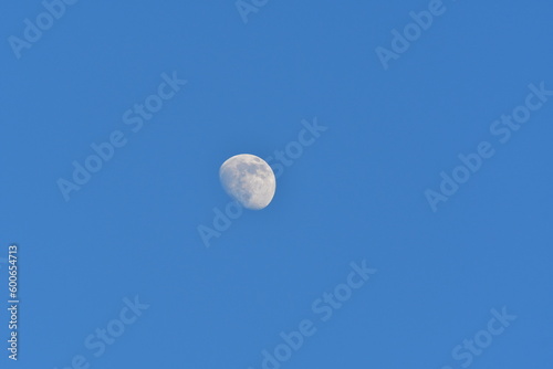 Moon at day blue sky background pattern