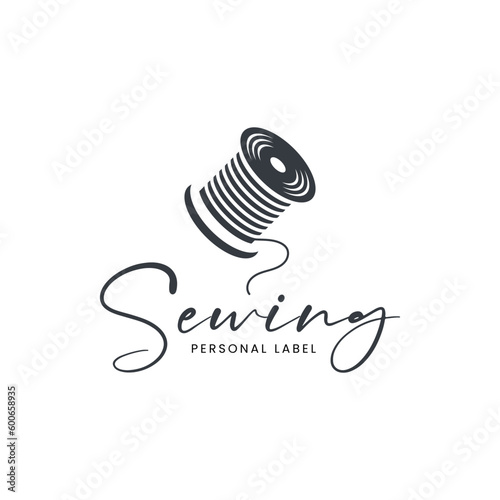 Unique logo combination of vinyl and thread spools.