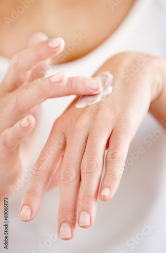 Hand cream, moisturizer and woman hands closeup with beauty and skin glow from treatment. Wellness, sunscreen and skincare lotion of a female person with manicure and cosmetics application with care