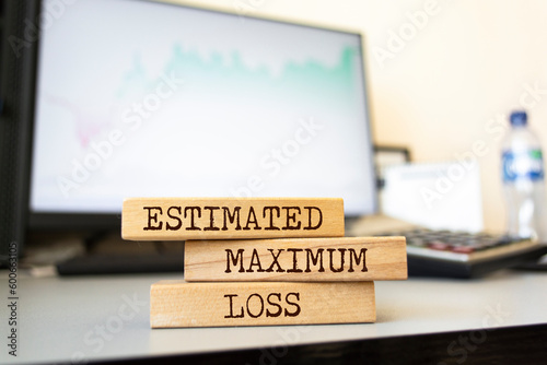 Wooden blocks with words 'ESTIMATED MAXIMUM LOSS'.
