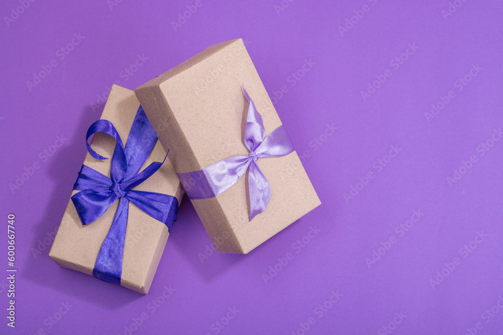 Zero waste gift concept. Bright roses, wrapped in paper surprise box for Anniversary, Mothers Day Zero waste gift concept. Bright roses, wrapped in paper surprise box for Anniversary, Mothers Day
