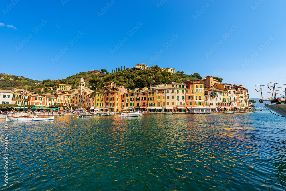 Cityscape and port of Portofino, luxury tourist resort in Genoa Province, Liguria, Italy, Europe. Colorful houses, Mediterranean sea (Ligurian sea).
