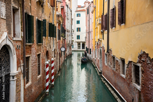 Narrow canal with gondolas in Venice, Italy © Maresol