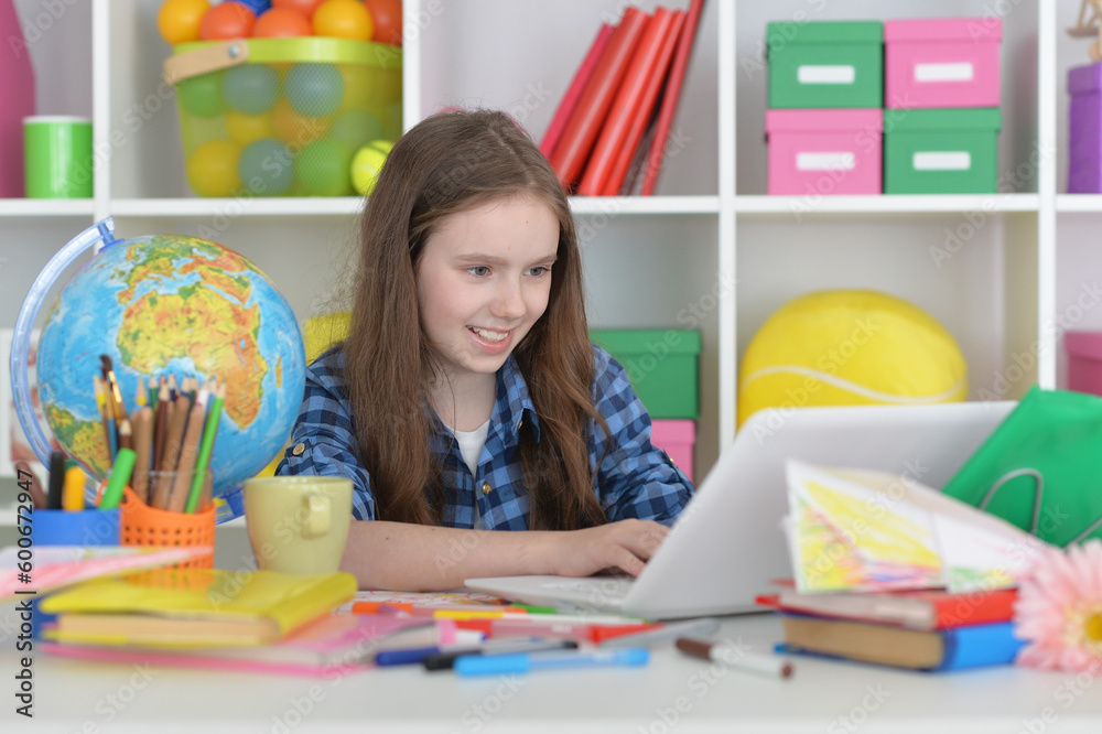 cute girl with laptop at home at desk cute girl with laptop at home at desk