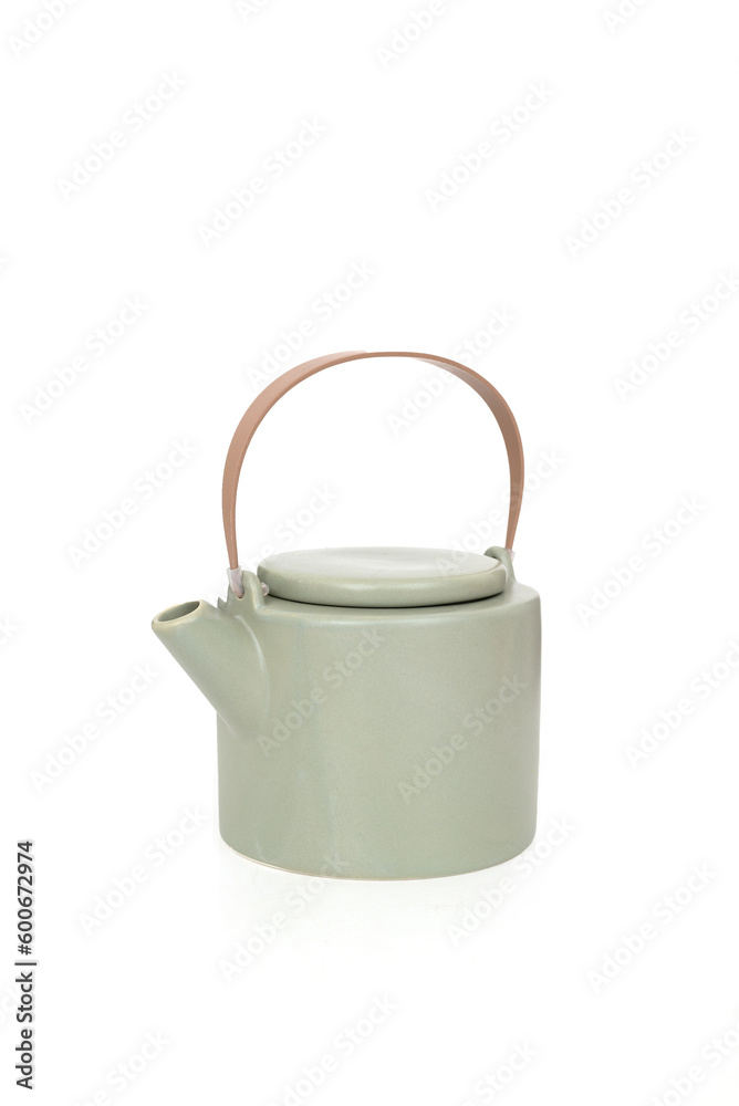 Porcelain light green teapot with a handle isolated on white Porcelain light green teapot with a handle isolated on white