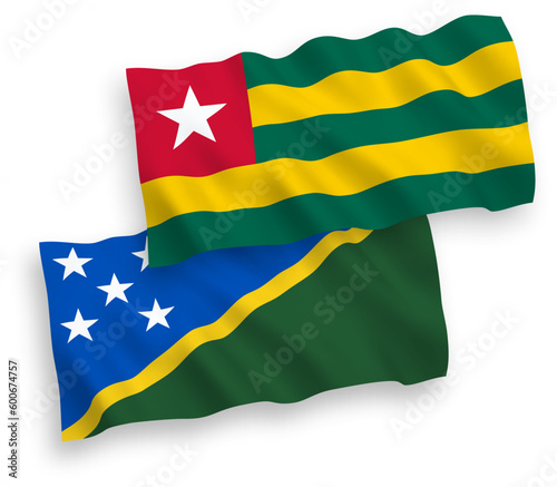 Flags of Togolese Republic and Solomon Islands on a white background