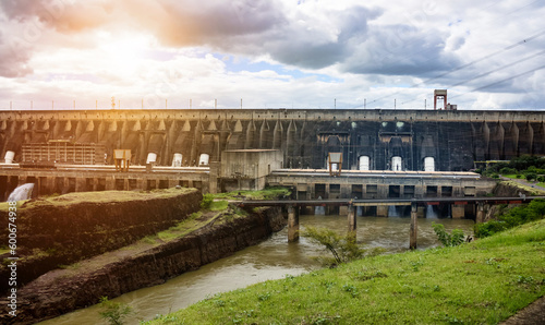 View of modern giant dam, located on Parana river. Itaipu Binacional hydroelectric power station in Foz do Iguazu Brazil on border with Paraguay. Hydro electrification concept. Copy ad text space