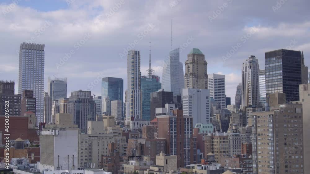 Lockdown Time Lapse Shot Of Modern Skyscrapers In City Against Cloudy Sky - New York City, New York Lockdown Time Lapse Shot Of Modern Skyscrapers In City Against Cloudy Sky - New York City, New York