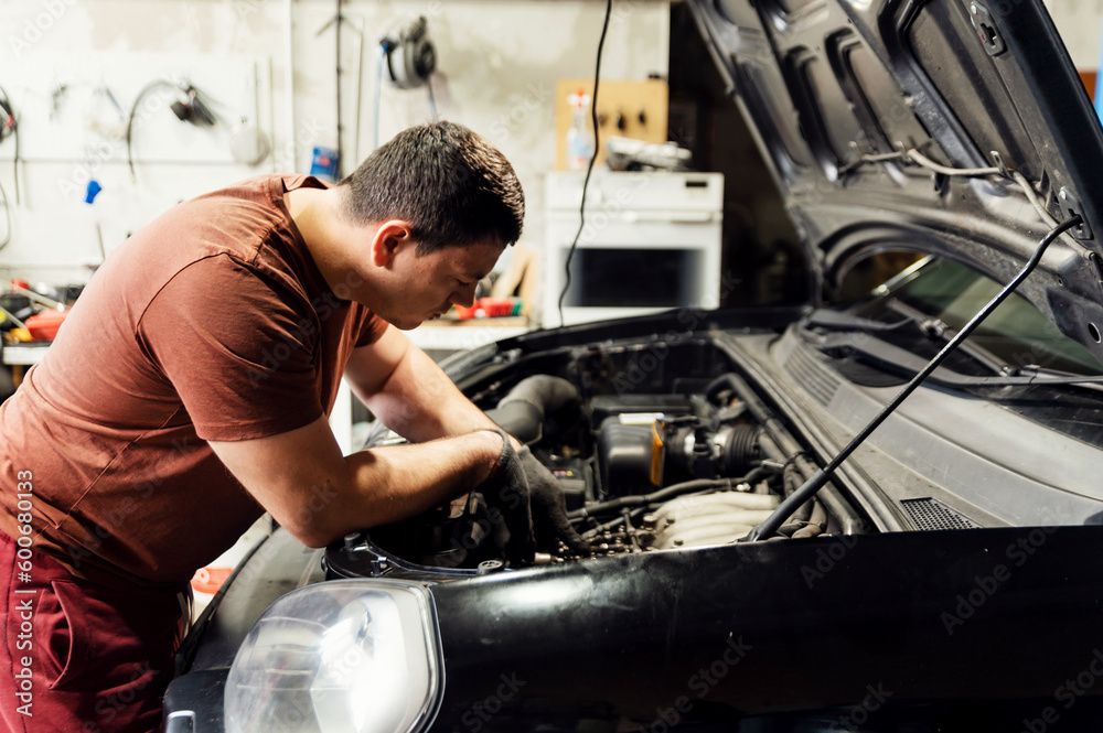 car service. under the hood. engine check. troubleshooting. check. specialist at work car service. under the hood. engine check. troubleshooting. check. specialist at work