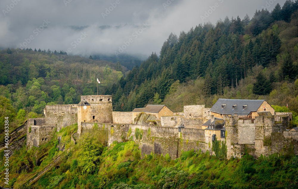 Bouillon Castle and the forests of the Ardennes in Belgium on a misty morning