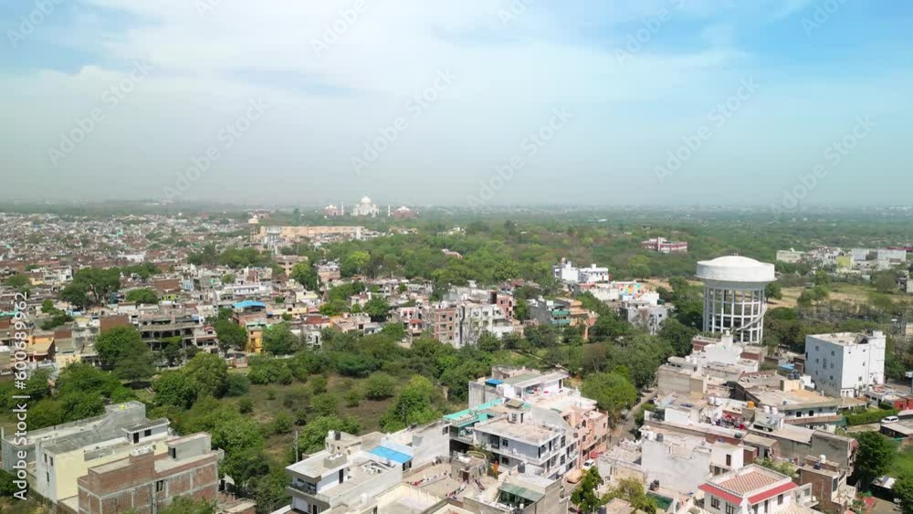 Agra: Aerial view of famous city in India (Uttar Pradesh), iconic Indian landmark Taj Mahal on horizon - landscape panorama of South Asia from above Agra: Aerial view of famous city in India (Uttar Pradesh), iconic Indian landmark Taj Mahal on horizon - landscape panorama of South Asia from above