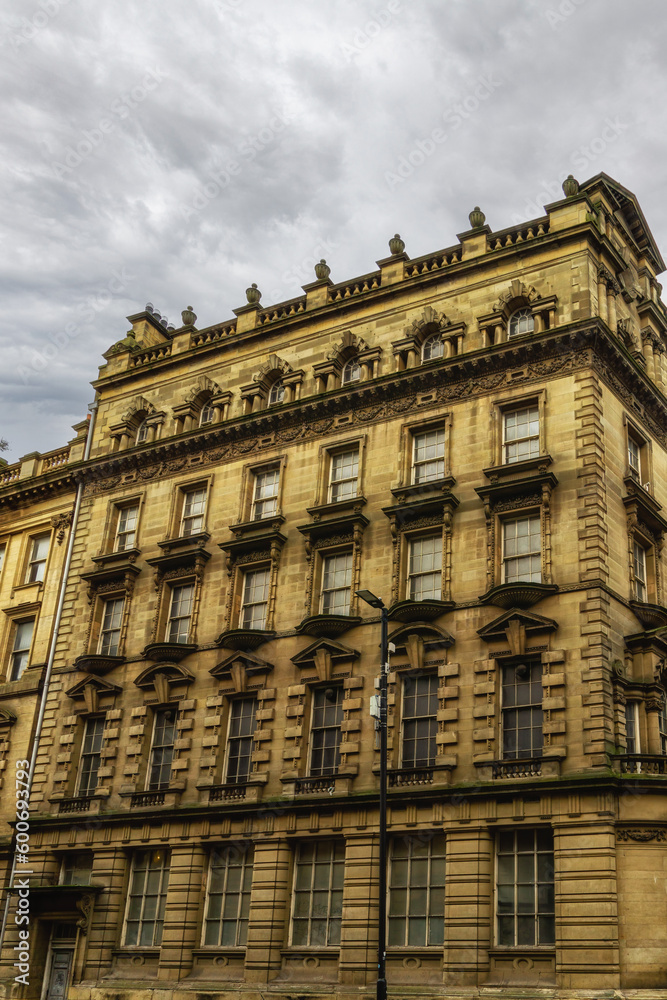 Facade and windows of one of the historic buildings in Newcastle Upon Tyne