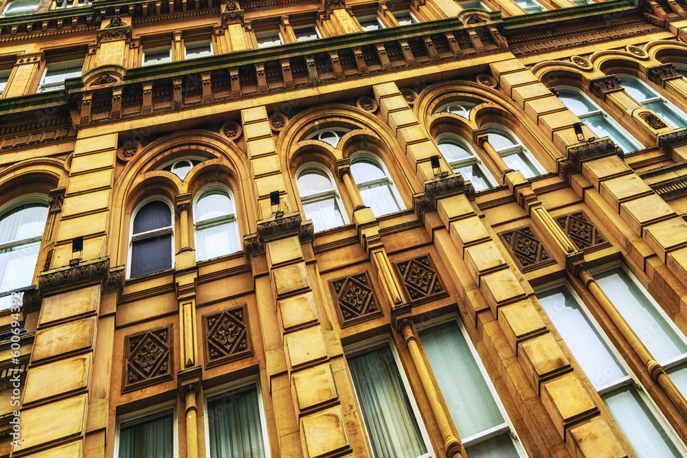 Facade and windows of one of the historic buildings in Newcastle Upon Tyne