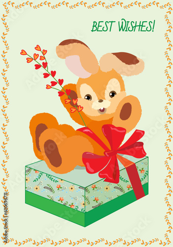 Toy bunny with a twig on a gift box.