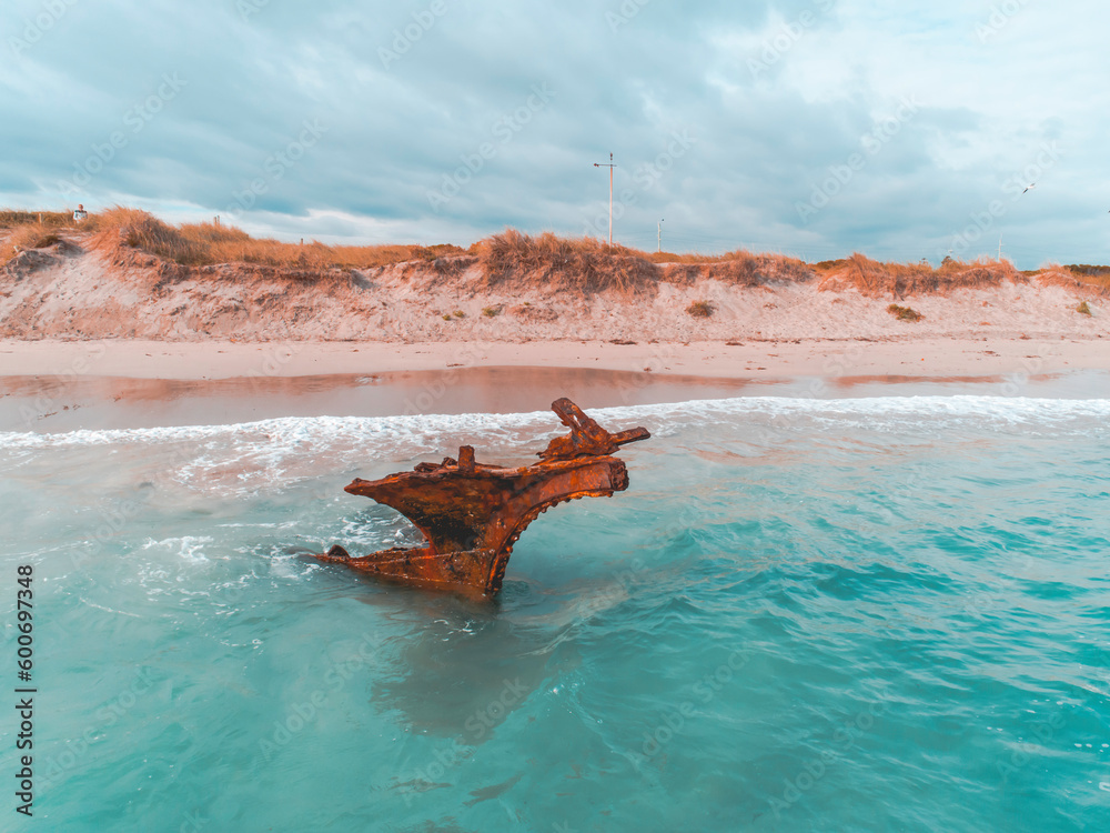 Rusted ship wreck on the beach. Wyola Tugboat Wreck in Perth, Western Australia. Seaside, coastal, seascapes