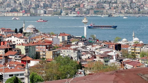 Dry cargo vessel sails across the Bosphorus strait in Istanbul, Turkey photo